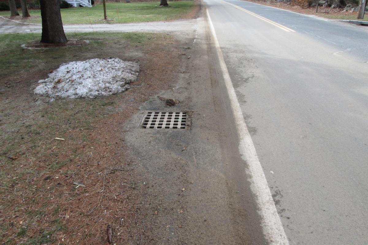 Photo of storm drain on shoulder of road 